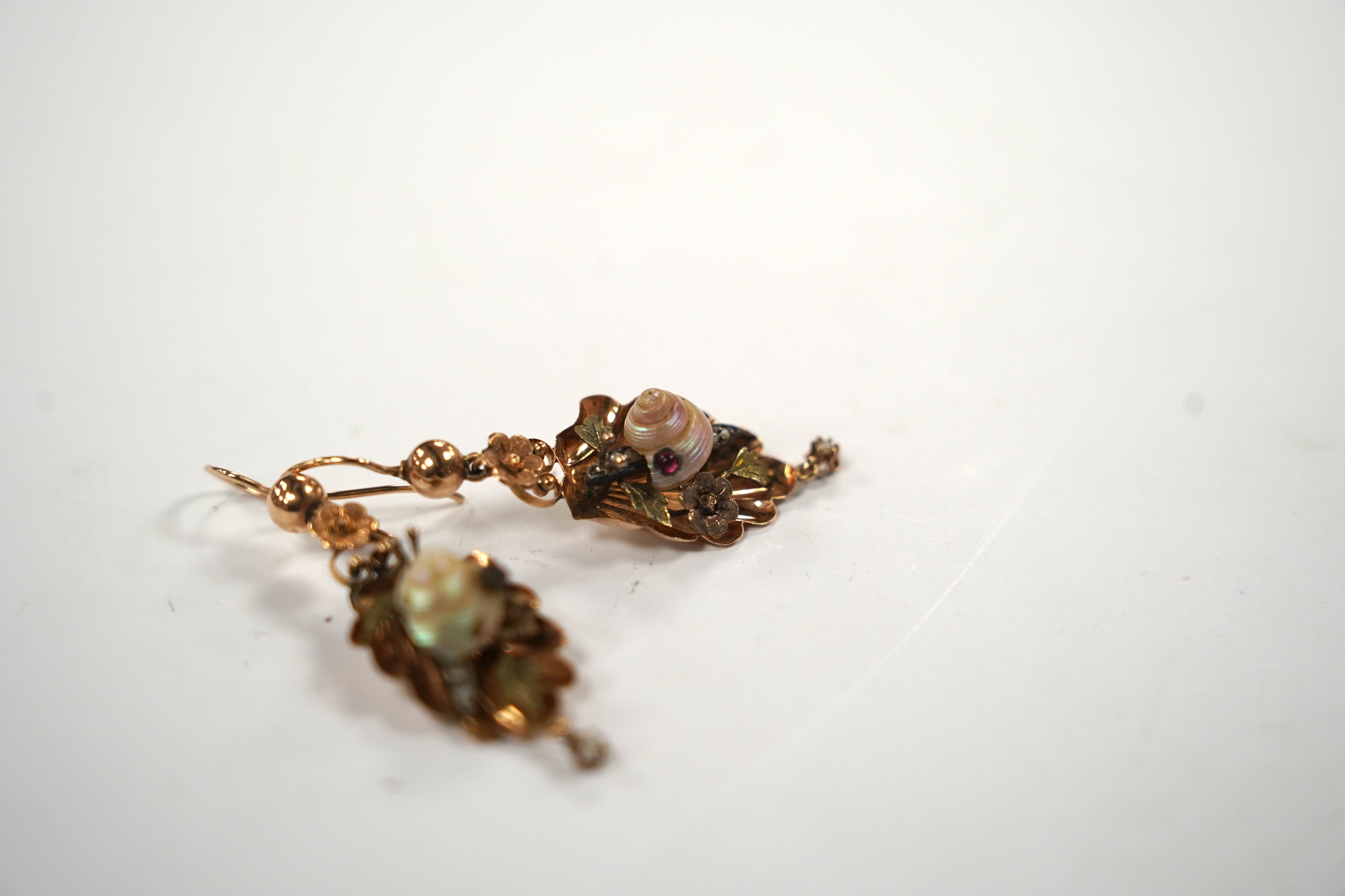 A pair of Victorian two colour yellow metal, cabochon gem and shell set drop earrings, each modelled as a snail upon a leaf, 38mm, gross weight 3.8 grams.